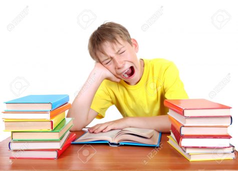 Tired Kid Yawning at the School Desk with a Books on the white background